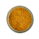 Top view of a glass jar filled with Saltopia Smoky Sweet Mustard Seasoning Low Sodium: MACK'S BACK by SALTOPIA Infused Sea Salts, featuring yellow and orange powder for healthy cooking, isolated on a white background.