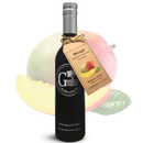 A bottle of Georgetown Olive Oil Co. Mango White Balsamic Vinegar, featuring a tag and originating from Modena, Italy, is displayed in front of a whole mango, a mango slice, and a green leaf on a white background.
