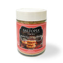 The SALTOPIA Infused Sea Salts Bacon Lovers Gift Set includes a jar of Maple Bacon Seasoning labeled “Jurassic Pork” with a red-and-white label featuring bacon strips—a delicious gift for any bacon fan.