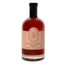 The Under The Bark Syrup Co Pure Maple Syrup comes in a glass bottle with a black cap and beige label, highlighting its 100% pure Grade A maple syrup, authentic maple flavor, and Minnesota origin.