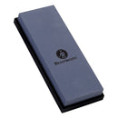 The Messermeister Restoration Stone - 400 & 1000 Grit is a rectangular sharpening stone with dual grit surfaces, a gray finish, black printed brand logo, and comes on a sturdy black base.