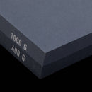A close-up of the Messermeister Restoration Stone - 400 & 1000 Grit, a rectangular dual-layered sharpening stone by Messermeister, with "400 & 1000 Grit" clearly marked on its edge.