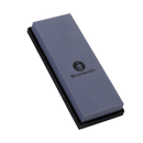 The Messermeister Restoration Stone - 400 & 1000 Grit is a rectangular gray sharpening stone with the Messermeister logo on top, resting on a black base against a white background.