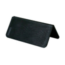 The Messermeister Adventure Chef Folding Faux Wood Cutting Board by Messermeister is a black, rectangular, textured case that stands open in a triangular shape, resembling an eyeglass case, perfect for your camp kitchen essentials.