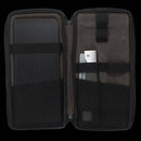 The Messermeister Adventure Chef Linen Basecamp Set - 3 Piece features a black zippered case with organized compartments for a notebook, chef-quality knives, and an extra accessory—ideal for outdoor cooking adventures.