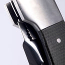 Close-up of the Messermeister Adventure Chef Linen Folding Peeler & Parer, featuring a metallic blade and textured dark handle with visible locking mechanism—perfect for outdoor cooking enthusiasts.