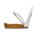 The Messermeister Adventure Chef Maple Folding Peeler & Parer features a wooden handle and two folding stainless steel blades—one smooth, one serrated—with the Messermeister brand name visible on the smooth blade.