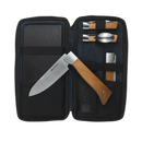 The Messermeister Adventure Chef Maple Summit Set - 6 Piece comes in a zippered black case and includes chef-grade knives and tools with maple wood handles, a large chef’s knife, three small utensils, plus a cutting board or notebook for outdoor cooking.