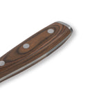 Close-up of the Messermeister Avanta Pakkawood Flexible Boning Knife - 7", highlighting its pakkawood handle with metal rivets, smooth wood grain, and polished edges against a white background.