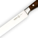 A close-up of the Messermeister Avanta Pakkawood Scalloped Slicer - 10" shows the brand engraved on the blade as it rests diagonally on a white background.