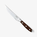 The Messermeister Avanta Smoked Teak Steak Knife Set (4 Piece) features high-carbon stainless steel blades and teak wood handles with three metal rivets, shown against a plain white background.