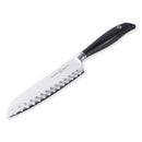 The Messermeister Blacksmith Kullens Santoku Knife - 6.5" features German stainless steel, a black ergonomic handle, and oval-shaped blade indentations for precision slicing—versatile and shown here against a white background.