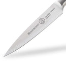 A close-up of the 3.5" Messermeister Blacksmith Paring Knife highlights its sharp blade and engraved "Messermeister" branding, showcasing the precision and craftsmanship of this high-quality kitchen tool.