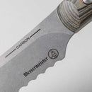 Close-up of the Messermeister Carbon Scalloped Knife - 9" blade, featuring 'CARBON' and the Messermeister logo. The handle's wood grain pattern highlights the beauty of this carbon steel knife.