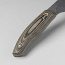 Close-up of the Messermeister Carbon Slicer - 9" handle, featuring layered textured wood with a smooth oval indentation and two metal rivets, set against a plain light background.