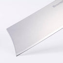 Close-up of the Messermeister Custom Blue Nakiri Knife - 6.5" by Messermeister, featuring a shiny silver blade with etched lettering and a sharp edge—perfect for expert vegetable cutting against a white background.