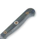 Close-up of a Messermeister Custom Blue 4 Piece Steak Knife Set handle featuring smooth blue-gray wood grain, secured with three gold screws. One end is slightly curved and rounded. The blade is not shown in the image.