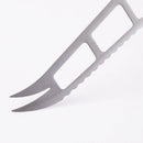 Close-up of the Messermeister Custom Cheese & Tomato Knife - 5" by Messermeister, featuring two prongs, rectangular blade cutouts, and a serrated edge against a white background.