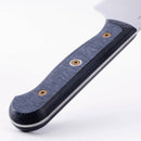 Close-up of the Messermeister Custom Chef's Knife - 8" handle, featuring an ergonomic, textured dark blue and black grip with two brass screws, set against a white background.