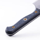 Close-up of the Messermeister Custom Nakiri Knife - 6.5" handle with a textured dark gray grip and two brass screws, highlighting Japanese-inspired design details, on a white background.