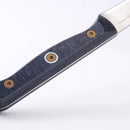 Close-up of the Messermeister Custom Paring Knife - 3.5" handle with a textured black and gray grip, three metal rivets, and an ergonomic design—ideal for precise prep—shown against a plain white background.