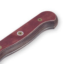 Close-up of the Messermeister Custom Red Chef's Knife - 8" with an ergonomic, reddish-brown layered wood handle and two metal rivets, offering a smooth finish and comfortable grip.