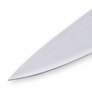 Close-up of the pointed tip of the Messermeister Custom Red Chef's Knife - 8" blade on a white background, highlighting its sharp edge, clean surface, and seamless transition to the ergonomic handle.