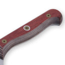 Close-up of the Messermeister Custom Red Nakiri Knife - 6.5" handle, featuring red wood scales and layered dark wood, secured with brass screws.