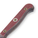 A close-up of the Messermeister Custom Red Paring Knife - 3.5" handle features visible layers, three metal screws, and a reddish wood tone with rounded edges, showcasing Messermeister's ergonomic craftsmanship.