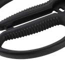 Close-up of the black plastic handles and textured grips of Messermeister Esther Choi Push Button Take-Apart Precision Shears - 7", showing part of the high-carbon stainless steel blade hinge against a white background.