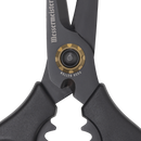 Close-up of the pivot area on black Messermeister Esther Choi Push Button Take-Apart Precision Shears - 7", highlighting the gold push button mechanism and part of the Messermeister brand name on a stainless steel blade against a white background.