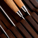 Close-up of the Messermeister In-Drawer Knife Holder - 11 Slot, neatly organizing knives with visible metal blades and polished handles—a sleek, space-saving knife storage solution from Messermeister for any kitchen drawer.
