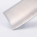 Close-up of a polished Messermeister Kawashima Nakiri Knife - 6.5" blade, crafted from SG2 powdered steel with a distinct wavy hamon line, shown against a plain white background.