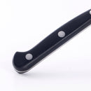 Close-up of the Messermeister Meridian Elite Bird's Beak Garnishing Knife - 2.5" handle, featuring two metal rivets, reminiscent of Solingen craftsmanship, isolated on a white background.