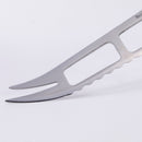 Close-up of the sharp pronged end and cutout blade of the Messermeister Meridian Elite Cheese & Tomato Knife - 5", featuring a serrated stainless steel edge.