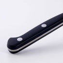 Close-up of the black handle with two metal rivets from the Messermeister Meridian Elite Fine Edge Steak Knife Set (4 Piece) by Messermeister, shown against a white background.
