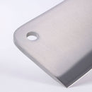 Close-up of the top corner of the Messermeister Meridian Elite Heavy Cleaver - 6", crafted from German stainless steel, featuring a hole near the edge and part of the blade, set against a plain white background.