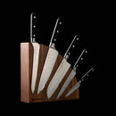 The Messermeister Meridian Elite Magnet Block Set - 6 Piece features German hand-forged knives with black handles, elegantly displayed in a Messermeister wooden block—combining quality craftsmanship and style for any kitchen.