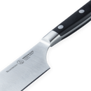 Close-up of the Messermeister Meridian Elite Nakiri Knife - 6.5", a kitchen essential with a sharp German-forged blade and black handle with two rivets, shown on a white background.
