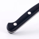 Close-up of the black handle with two metal rivets on the Messermeister Meridian Elite Sheep's Foot Paring Knife - 3.5", crafted in Solingen, Germany, shown against a plain white background.