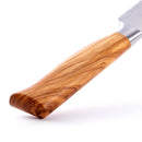 Close-up of the Messermeister Oliva Elite Kullens Carving Knife - 8" featuring a polished olive wood handle with unique grain patterns, set against a white background. The partially visible blade appears at the top right.