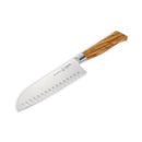 The Messermeister Oliva Elite Kullens Santoku Knife - 7" features a stainless steel blade with hollow edge, oval indentations, and a light olive wood handle, shown against a white background.