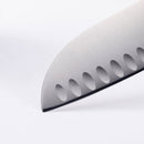 A close-up of the Messermeister Oliva Elite Kullens Santoku Knife - 7" blade, crafted from stainless steel with hollow edge indentations, shown against a plain white background.