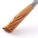 Close-up of the Messermeister Oliva Elite Nakiri Knife - 6.5" shows a light olive wood handle with dark grain, joined by a metal bolster to its German-forged blade—ideal for precise vegetable prep—displayed against a white background.