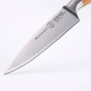A close-up of a Messermeister Oliva Elite Spear Point Paring Knife - 3.5", made from German stainless steel with a wooden handle, photographed on a white background.