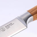 Close-up of the Messermeister Oliva Elite Utility Knife - 6", featuring a German stainless steel blade engraved with OLIVA ELITE SOLINGEN-GERMANY and logo, and an elegant olive wood handle, on a plain white background.