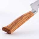 Close-up of the Messermeister Oliva Elite Offset Scalloped Bread Knife - 8" with a polished wooden handle and partial German stainless steel blade, shown against a white background.