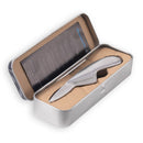 The Messermeister Oyster Knife - 6.5" features a compact, ergonomic silver handle and an engraved stainless steel blade, presented in a fitted metal case with a cardboard insert and care instructions inside the lid.