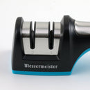The Messermeister Pull Through Sharpener by Messermeister features two labeled slots (1 and 2), a modern black and blue design, and stainless steel accents.