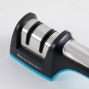 The Messermeister Pull Through Sharpener by Messermeister features two sharpening slots, black and silver accents, and a blue base, shown close-up on a white background.